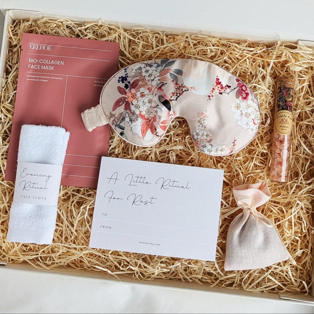 Gift set with mulberry silk sleep mask, facial mask, towel, and card in a box