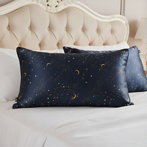 Navy blue pillowcases with celestial pattern on a bed